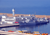 Oran, Algeria / Algrie: harbor - the Rais Korfu (903) - Murat Reis / Koni class frigate - Soviet Project 1159, built in Zelenodolsk - Algerian Navy - Societe General Maritime building - photo by M.Torres |  le port - la frgate Rais Korfu (903) et le difice de la Societe General Maritime - Bassin Mostagane