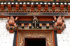 Bhutan - Thimphu - inside Trashi Chhoe Dzong - beautiful wood carvings - sumo wrestlers - photo by A.Ferrari