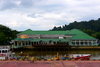 Bangar, Temburong District, Brunei Darussalam: government complex and the oil products tanker Balait Surita on the Temburong river - photo by M.Torres