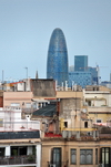 Barcelona, Catalonia: Jean Nouvel's Agbar tower and other modern buildings seen with old residential buildings in the foreground - photo by M.Torres