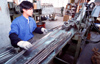 Dongguan, Guangdong province, China: metal worker - Chinese factory - photo by B.Henry