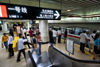 Shanghai, China: subway - Stadium station - escalator and train arriving - photo by Y.Xu