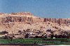 Egypt - Karnak: fields, houses and tombs under the cliffs (photo by Miguel Torres)