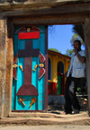 Gondar, Amhara Region, Ethiopia: Royal Enclosure - Gemjabet Maryam church - man at the gate - photo by M.Torres