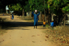 Praia de Varela / Varela beach, Cacheu region, Guinea Bissau / Guin Bissau: Old man and child walking on the street, everyday life / homem grande e crianas a andar na rua, vida quotidiana - photo by R.V.Lopes