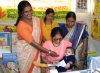 India - Uttaranchal state: women giving family planning information during a village festival (photo by Rod Eime)