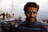 Darjeeling, West Bengal, India: roadworker and tar drums - photo by G.Koelman