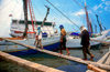 Sunda Kelapa, South Jakarta, Indonesia - workers return to a pinisiq / phinisi / pinisi boat - the old port of Sunda Kelapa - photo by B.Henry