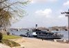 North Korea / DPRK - Pyongyang: Pleasure boat on the Taedong River and the Ongnyu bridge - background the May Day stadium (photo by M.Torres)