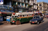 Myanmar - Bago / Pegu: city traffic - bus - photo by W.Allgwer - ffentlicher Verkehr mit veralteten Bussen in Bago. Die Busse sind total berfllt, so das die Menschen zum Teil auf dem Dach sitzen. Die Kleinbusse (Pickups) stellen die Nahverkehrsverbind