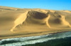 Namibia: Aerial view of Skeleton Coast - beach - Ocean meets Sand dunes - photo by B.Cain