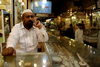 Lahore, Punjab, Pakistan:jeweler waiting for customers at the gold market - photo by G.Koelman