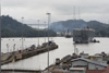 Panama Canal: car transporting vessel exits the Miraflores locks- Centennial bridge and Pedro Miguel locks in the background - photo by H.Olarte