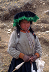 Ausangate massif, Cuzco region, Peru: young Quechua girl spinning wool on the high Altiplano - Ausangate trek, Peruvian Andes - Cordillera Blanca - photo by C.Lovell