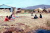 Lake Titicaca - Puno region, Peru: village life - Uro indians village - floating rafts made of totora reeds - photo by J.Fekete