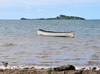 Anse Baleine, Rodrigues island, Mauritius: boat and the silhouette of Hermitage Island - Ile Hermitage - photo by M.Torres