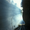 Russia - Guamskoe gorge - Krasnodar kray: ray of light over the railway line - photo by Vladimir Sidoropolev