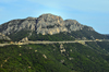 Dorgalia / Durgli, Nuoro province, Sardinia/ Sardegna / Sardigna: the SS125 road has to be protected by a slab as it goes under a vertical rock wall - imposing limestone cliffs - Strada statale 125 - Via Orientale Sarda - photo by M.Torres