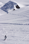 Slovenia - snow covered house and child skiing on Vogel mountain in Bohinj - photo by I.Middleton