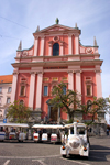 Franciscan church of the Annunciation and tourist train, Ljubljana, Slovenia - photo by I.Middleton