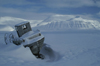 Svalbard - Spitsbergen island - Van Mijenfjorden: old boat in the snow - stern - Kolfjellet in the background - photo by A. Ferrari