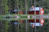 lvdalen, Dalarnas ln, Sweden: red cottage by the lake Navarsj in the evening light - photo by A.Ferrari