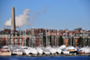 Boston, Massachusetts, USA: Charlestown - Constitution Marina - moored and covered sailboats with the Bunker Hill obelisk in the background - photo by M.Torres