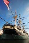 Baltimore, Maryland, USA: sloop-of-war USS Constellation berthed at Pier 1 - stern view with flag in the wind - Inner Harbor - Baltimore Maritime Museum - photo by M.Torres