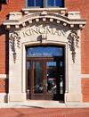 Oklahoma City, OK, USA: Bricktown, former Warehouse District - entrance of the Kingman-Moore Building - brick and decorative limestone - ribbons hang from each side of the center floral pattern, with a layered ribbon flowing from beneath the center - 100 E. California Avenue - photo by M.Torres