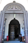 Stone Town, Zanzibar, Tanzania: grand entrance with large carved doors - House of Wonders - Beit Al-Ajaib - Mizingani Road - photo by M.Torres