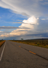 Costilla County, Colorado, USA: dramatic sky with distant rain over route CO-169, south of San Luis - stratus, cumulus and cirrostratus clouds - emptiness of the great spaces - photo by M.Torres